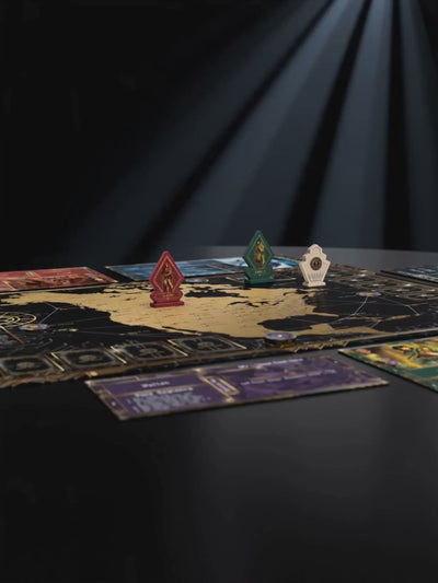 A cinematic close-up showcase of Kryptothera board game components arranged across the game map. The camera moves between The red player Veteran hunter standee, the round tracker standee and a hexagon Bigfoot legendary cryptid token, using dramatic lighting, shallow focus and smooth transitions to highlight the artwork and component details.